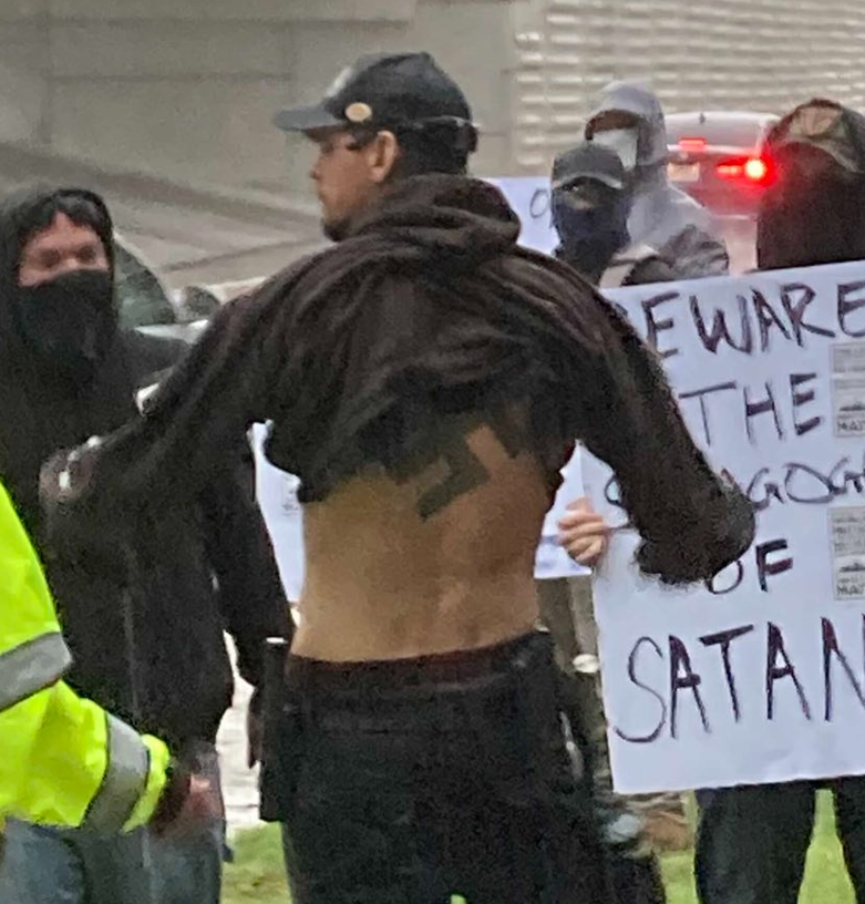 Ronald Murray's back swastika tattoo at White Lives Matter Houston Rally in 2022